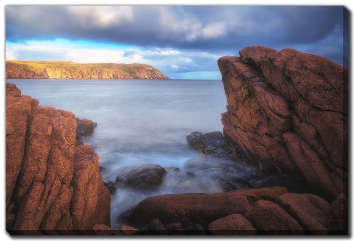 Distant Sunlight Reddish Rock Shoreline